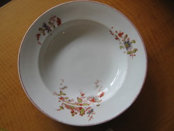 Antique, hand-painted soup plate that can be hung on the wall.