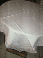 Charming antique white checkered damask tablecloth trimmed with floral ribbon