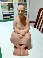 Statue of a seated woman