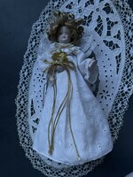 A very beautiful white-clothed angel Christmas tree, top decoration