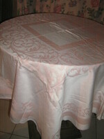 Beautiful pink vintage baroque patterned damask tablecloth with slippery decoration