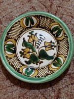 Ceramic wall plate with a diameter of 20 cm.