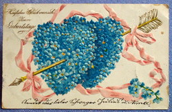 Antique embossed greeting card - two nefeljcs hearts pierced with a golden arrow from 1905