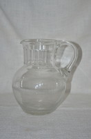 Broken glass jug with polished decoration