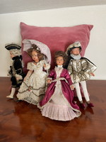 4 dolls dressed as gentlemen.