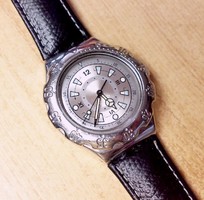 Swiss swatch quartz wristwatch with chrome casing, rotating bezel, leather strap