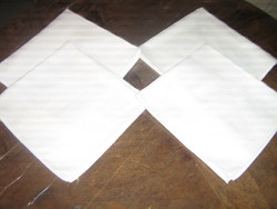 White damask napkin with a beautiful flower pattern