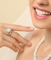 Silver-colored crystal ring with a white glass pearl in the middle is very beautiful.