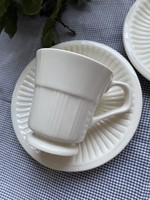 A small mug with clean lines and a cream-colored bottom