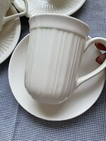 Clean-lined cream-colored cocoa mug with bottom