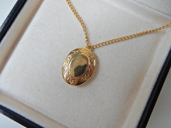 Old gold-plated pendant with photo holder on a chain
