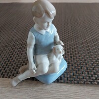 A sitting boy with a dog, hand-painted German porcelain