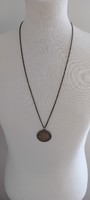 Bronze pendant on a chain