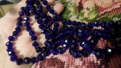118 Cm necklace made of blue crystal beads, knotted per eye, without clasp.