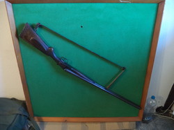 Deactivated Belgian 12-gauge shotgun.
