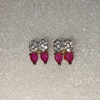 Used metal earrings with ruby stones in good condition