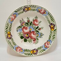 Rhyolite wall plate with colorful flower bouquet pattern marked 
