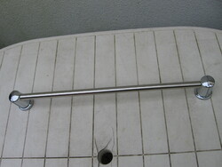 Silver colored towel rack