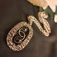 Silver-plated onyx stone craftsman pendant with chain.