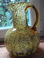 The glass vase is huge, with a pattern in the material