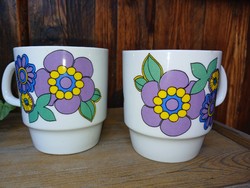 A pair of retro lowland porcelain mugs with a hippie pattern