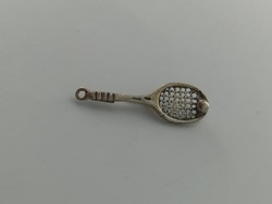 Silver pin, tennis racket with ball