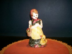 Ceramic shopping little girl with duck 13 cm tall.