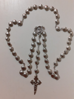 A rosary reader made of shell-shaped beads in good condition.
