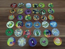 18 megaman tazos, made of metal (yu gi oh) and 17 pokemon tazos, in one