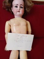 Antique doll with horseshoe mark