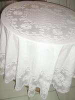 Embroidered filigree tablecloth sewn in beautiful white material