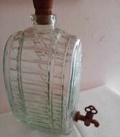Glass barrel with copper tap.