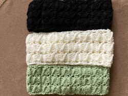 Three crocheted headbands in green, butter and black