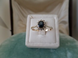 Gold ring with blue sapphire and brils 9k