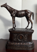 Horse bronze statue on a classical bronze platform