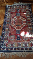 Medium-sized handmade woolen Persian rug in good condition