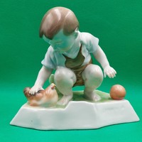 András Zsolnay Sinkó porcelain figure of a child with a hen