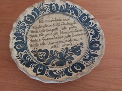 Old wall plate with a homemade blessing in Romanian