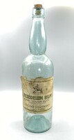 A bottle of Feudelem rum vítez cájlik with Lajos Redeti label