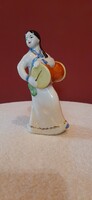 Porcelain statue. Lady with a drum. Hand painted, marked 12 cm tall statue. Presumably North Korean.