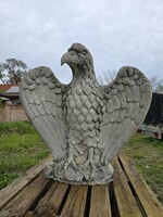 Old, old artificial stone eagle statue