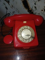 Red telephone with retro dial