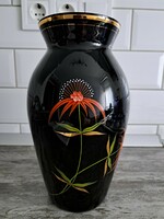 Black vase with floral pattern