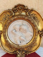 A pair of brothers on an antique wall decoration with marble inlays,,gilded,carving in a wooden frame,,35x35 cm,,
