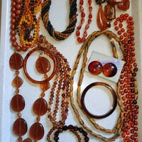 13.Cs. Used amber jewelry package in good condition