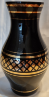 Black vase with gold decoration