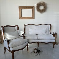 Small sofa upholstered in vintage linen