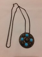 Necklace with a larger, round pendant (with turquoise decoration)