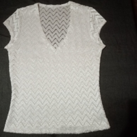 White blouse with padding on the front, transparent - elastic material on the back.