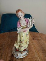 Figurative sculpture of a Baroque lady with a lute, marked Meissen
